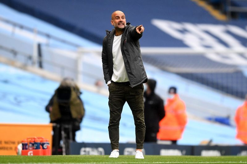 Pep Guardiola, Manager of Manchester City gives his team instructions