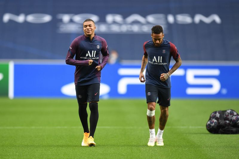 Neymar and Kylian Mbappe look on during a PSG Training Session