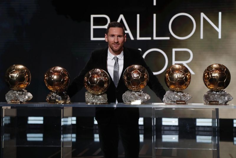 Lionel Messi posing with his six Ballon d&#039;Or awards