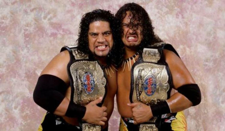 Fatu and Samu with the WWF Tag Team Championship belts