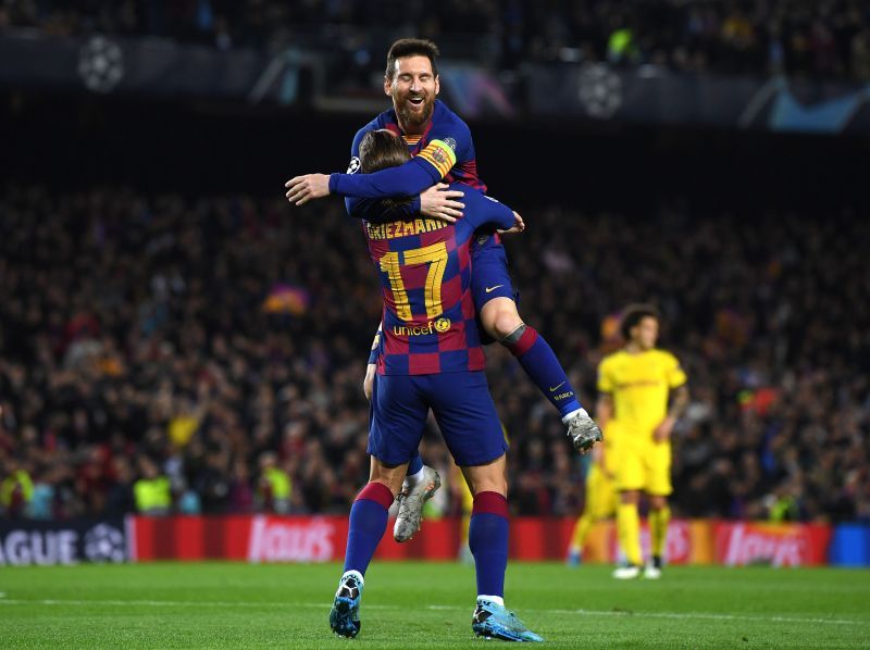 Antoine Griezmann of FC Barcelona celebrates with teammate Lionel Messi