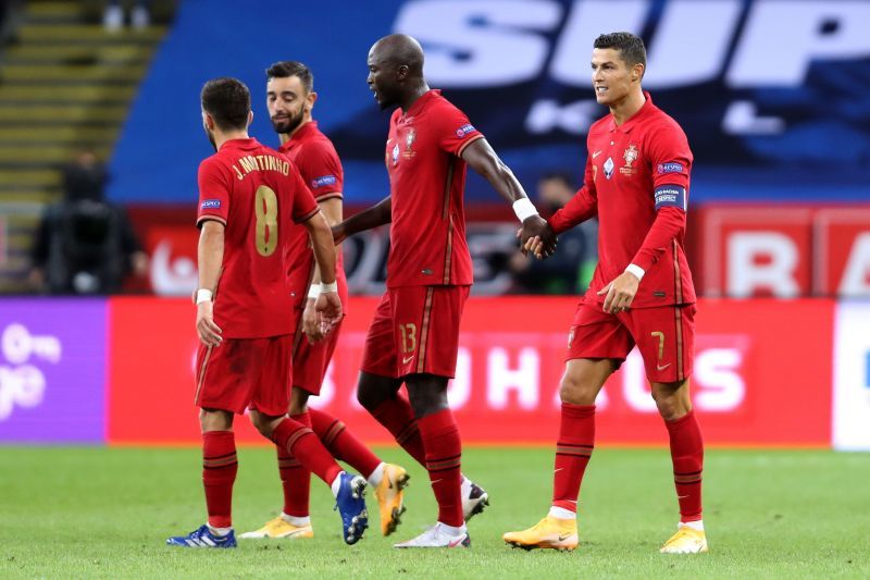 Cristiano Ronaldo celebrates with his teammates after opening the scoring for Portugal