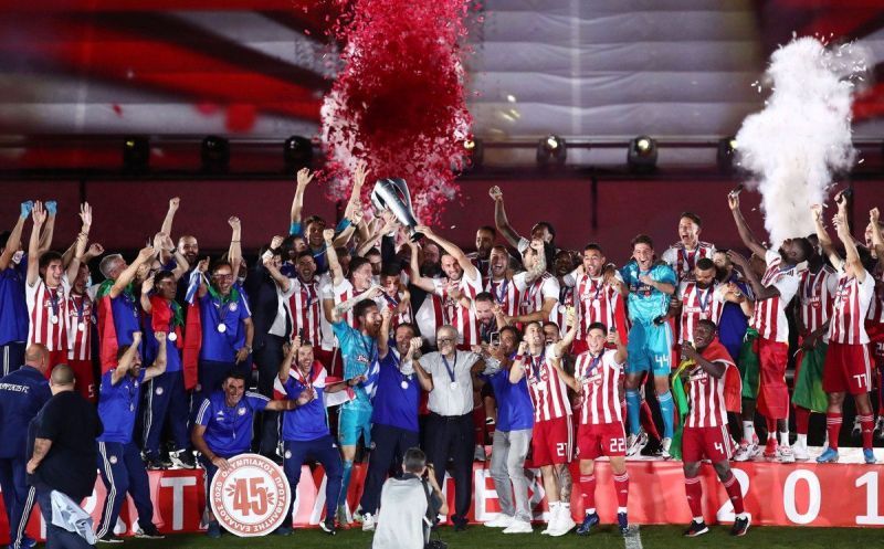 Olympiacos celebrate their 45th Greek title last season.