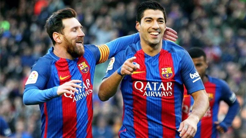 Lionel Messi and Luis Suarez (right)