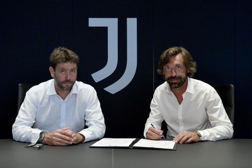 Andrea Pirlo (right) being unveiled as the new Juventus manager