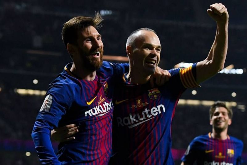 Lionel Messi and Andres Iniesta (centre)