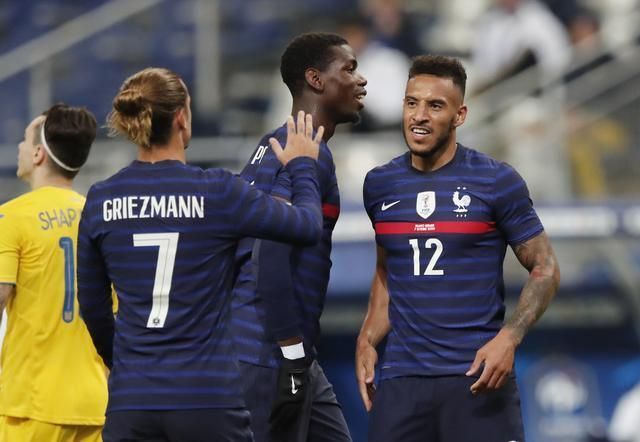 Corentin Tolisso celebrates after scoring a goal for France