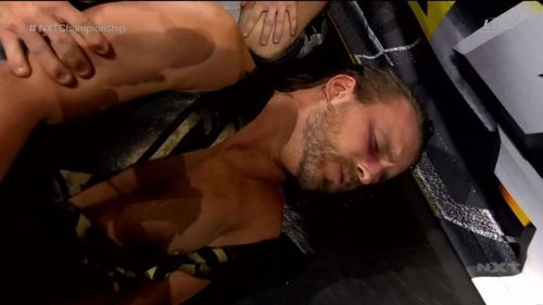 Adam Cole after getting laid out by Ridge Holland