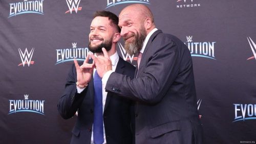 Finn Balor with Triple H