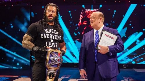 Roman Reigns with Paul Heyman and the WWE Universal Championship