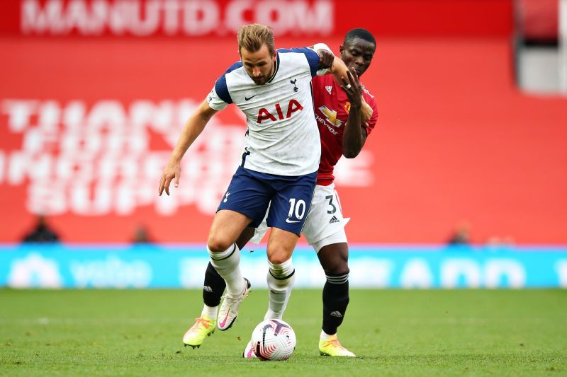 Eric Bailly tussling with Harry Kane for possession