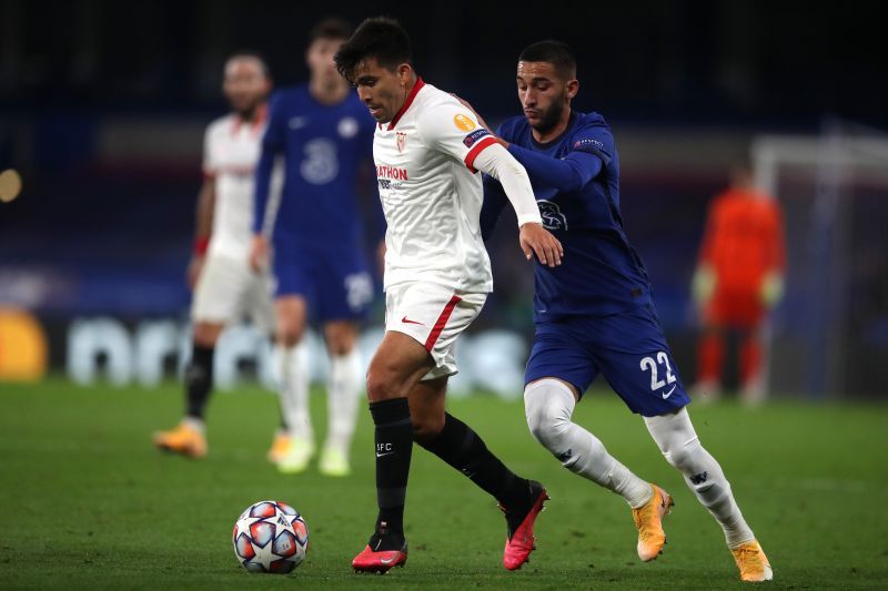 Marcos Acuna of FC Sevilla is challenged by Hakim Ziyech of Chelsea