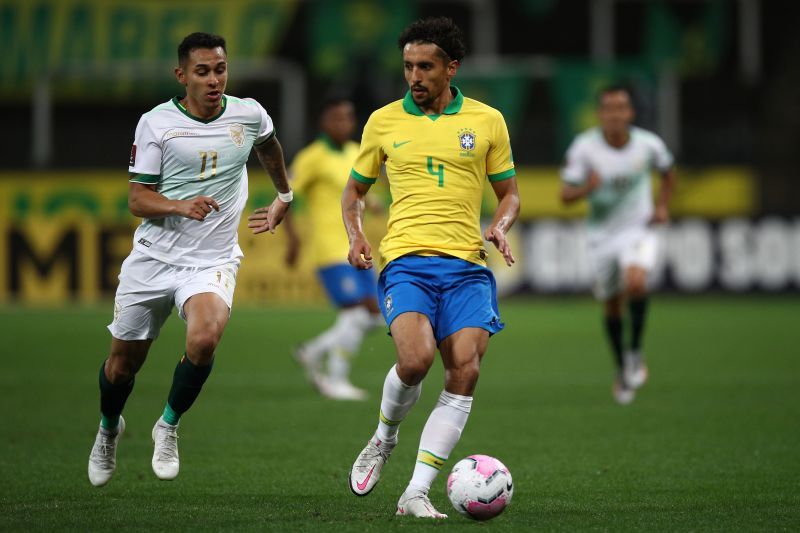 Marquinhos (right) of Brazil fights for the ball with Bruno Miranda of Bolivia.