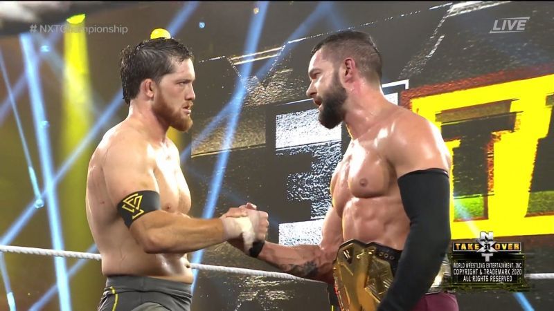 Kyle O&#039;Reilly and Finn Balor showing mutual respect following their match