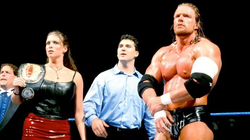 Stephanie alongside husband Triple H and brother Shane McMahon