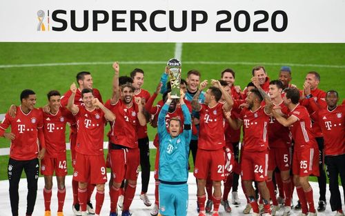 Bayern Munich players celebrate as Manuel Neuer lifts the German Supercup after beating Borussia Dortmund