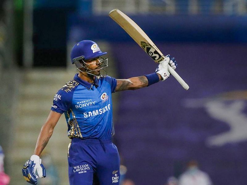 Hardik Pandya raises his bat after reaching fifty against the Rajasthan Royals.