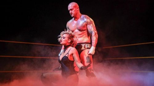 Former WWE NXT Champion Karrion Kross and Scarlett Bordeaux pose in the ring together