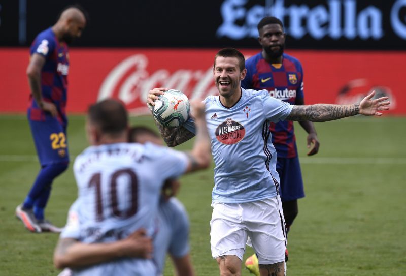 Smolov celebrates scoring his sides first goal against Barca in the corresponding fixture from last season