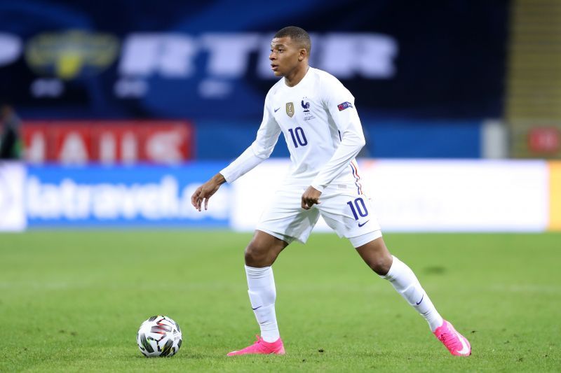 Kylian Mbappe of France runs with the ball 