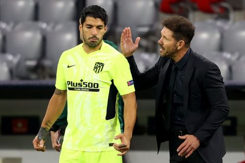 Luis Suarez (L) and Diego Simeone (R) of Atletico Madrid