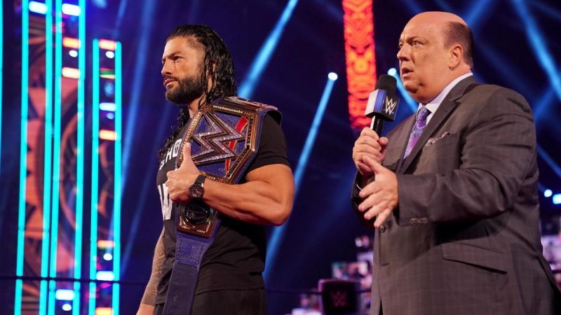 Roman Reigns with Heyman and his Universal Championship on SmackDown