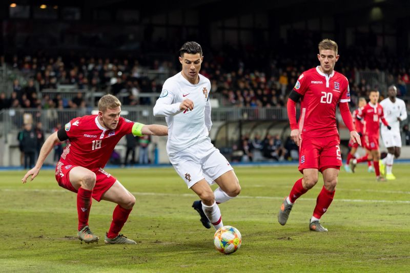 Cristiano Ronaldo (white) in action against Luxembourg