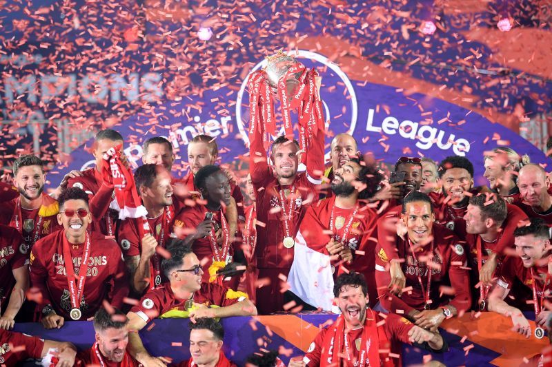 Liverpool players celebrate after winning the Premier League