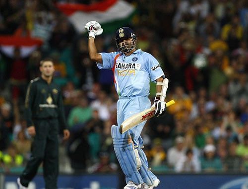 Sachin Tendulkar celebrates scoring a hundred in the first final of the CB Series in 2008 