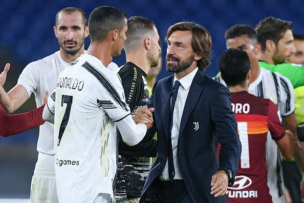 Andrea Pirlo congratulates Cristiano Ronaldo whose brace saved Juventus' blushes at AS Roma.