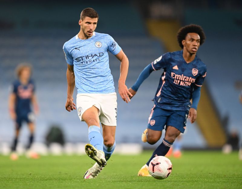 Manchester City centre-back Ruben Dias (left)