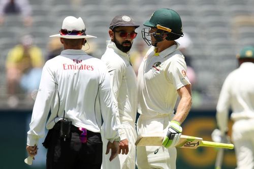 Virat Kohli (L) and Time Paine (R) during India's 2018/19 tour