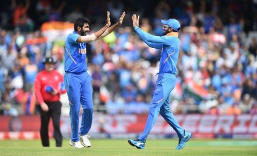 KL Rahul and Jasprit Bumrah celebrate a wicket during the Cricket World Cup 2019