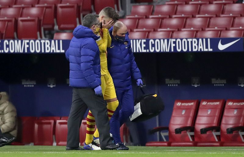 Gerard Pique limps off against Atletico MadridS