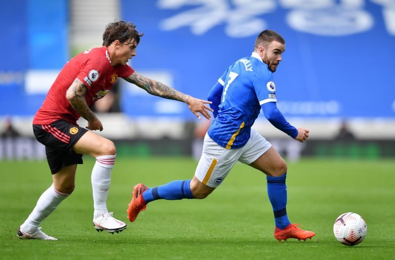 Aaron Connolly of Brighton and Hove Albion is challenged by Victor Lindelof of Manchester United