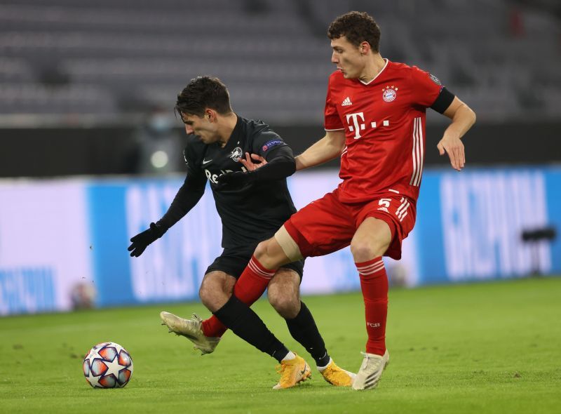 Benjamin Pavard and Dominik Szoboszlai tussle it out for the ball