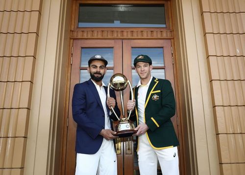 Virat Kohli (L) and Tim Paine (R) with the 2018/19 Border-Gavaskar Trophy