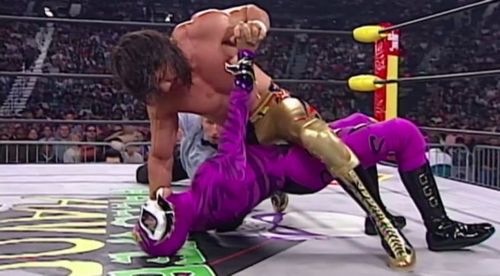 Eddie Guerrero and Rey Mysterio grapple in the ring during their WCW 'mask vs title' match