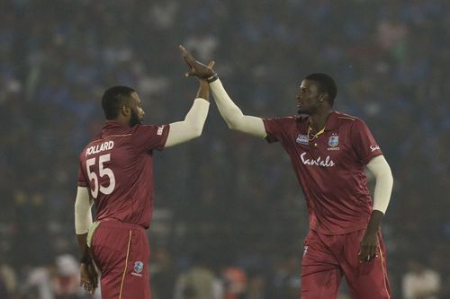 Kieron Pollard (L) and Jason Holder (R) will lead the West Indies' T20I and Test sides respectively.