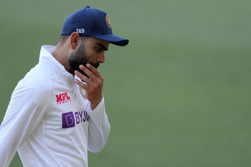 Virat Kohli of India walks off the field after a devastating loss against Australia at Adelaide