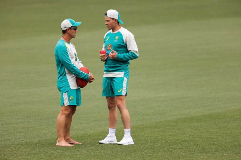 Tim Paine (R) and Justin Langer (L) during a nets session