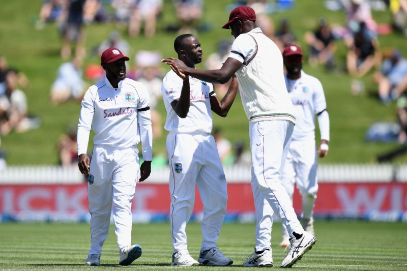 Kemar Roach celebrates a wicket with West Indies teammates