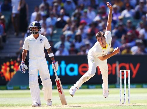 Pat Cummins (R) and Virat Kohli (L) in action during the 2018-19 Border-Gavaskar Trophy