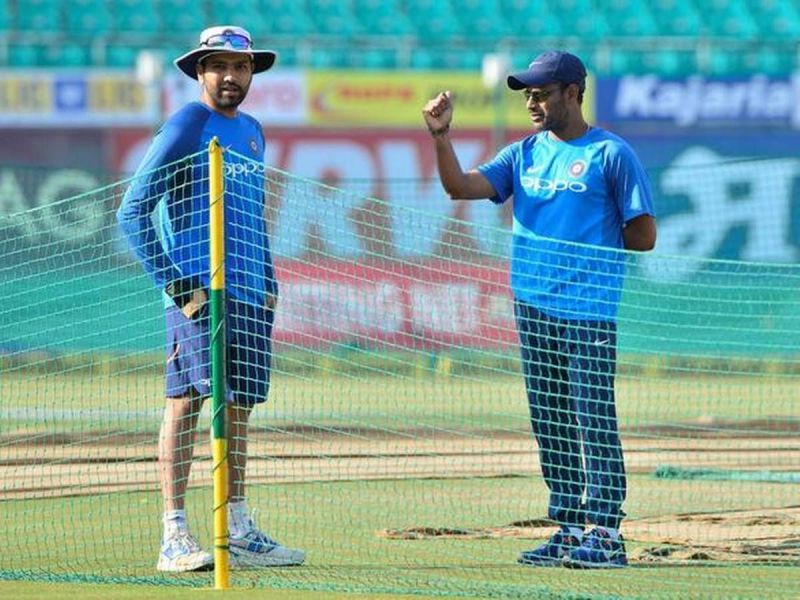 R Sridhar (R) with Rohit Sharma (L) during a fielding session