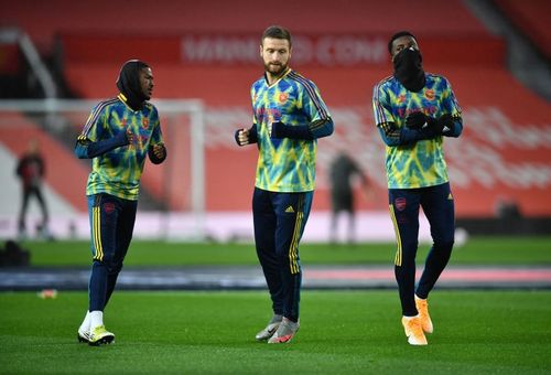 Shkodran Mustafi warms up at Old Trafford.