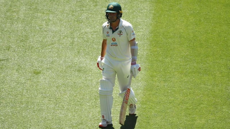 Joe Burns walking away after his dismissal