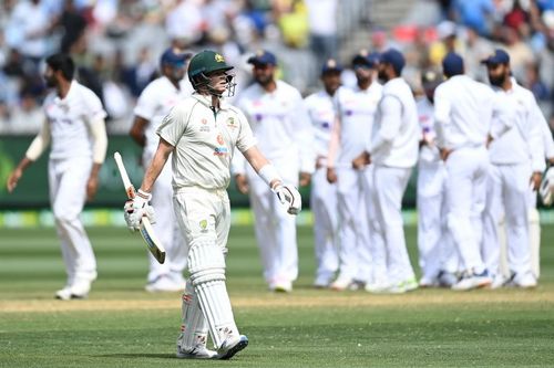 A stunned Steve Smith takes the long walk to the MCG pavilion.