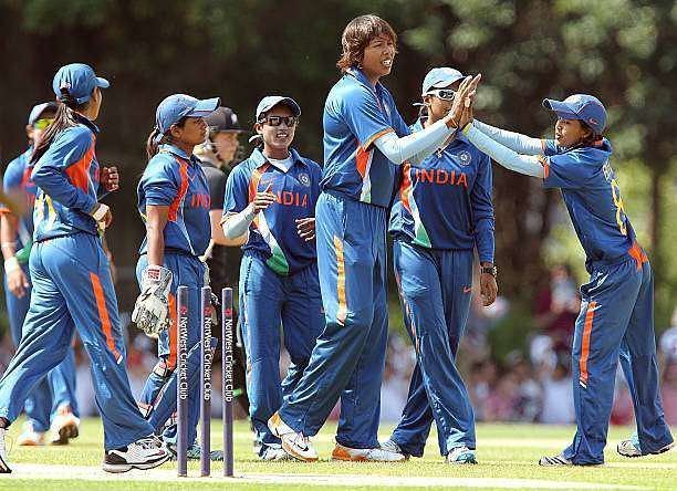 The Indian team celebrate after picking up a wicket.