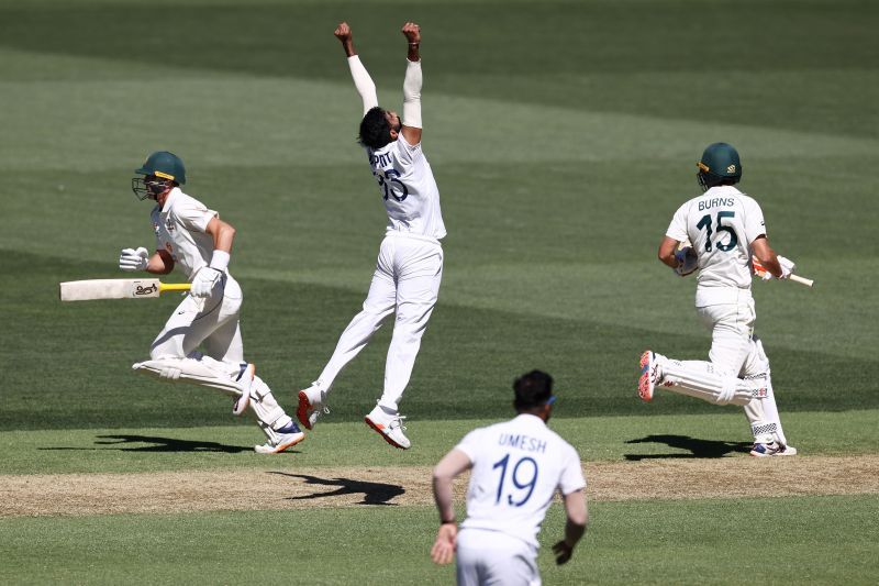 Jasprit Bumrah leaps in joy after getting a wicket.