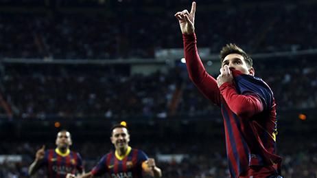 Lionel Messi kissing the Barcelona badge after a memorable hat-trick at the Santiago Bernabeu in 2014.